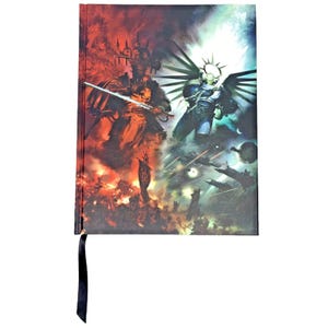 May include: A black and red notebook with a cover featuring a dramatic scene of two figures in battle, one with a sword and the other with wings. The background shows a chaotic scene of space battles and explosions.