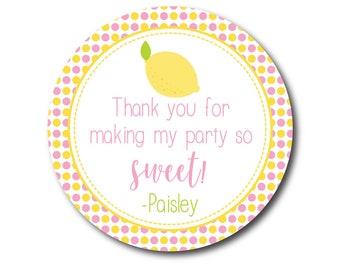 May include: Round pink and yellow polka dot thank you sticker with a lemon illustration and the text "Thank you for making my party so sweet! -Paisley"