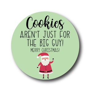 May include: A green circle with the text "Cookies aren't just for the big guy! Merry Christmas!" and a cartoon image of Santa Claus.