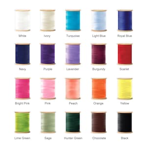 May include: A collection of colorful thread spools in various shades, including white, ivory, turquoise, light blue, royal blue, navy, purple, lavender, burgundy, scarlet, bright pink, pink, peach, orange, yellow, lime green, sage, hunter green, chocolate, and black.