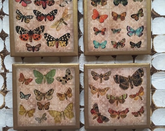 Sottobicchieri a farfalla: sottobicchieri in ceramica con finiture dorate, set da 4