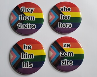 Pronoun LGBTQIA pinback buttons, fridge magnets, keychains, pocket mirrors, bottle opener magnets