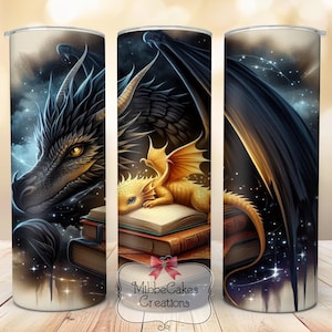 May include: A set of three stainless steel tumblers featuring a fantasy dragon theme. The design includes a black dragon, a golden dragon, and a starry night sky. The tumblers have a white background and the text "MilbeCakes Creations".