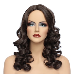 May include: A long, dark brown wig with loose curls. The wig is styled in a classic, feminine way and is perfect for a variety of occasions.