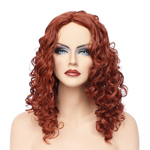 May include: A long, curly, auburn-colored wig with loose, voluminous curls.