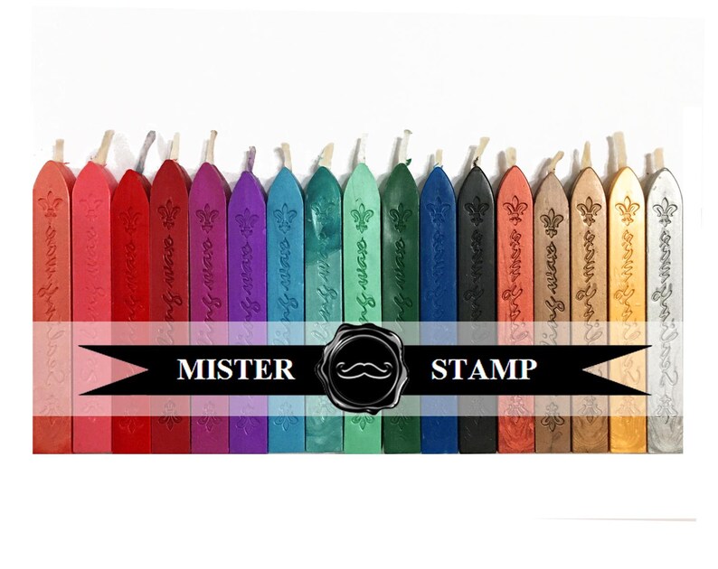 May include: Assortment of 24 sealing wax sticks in various colors, including red, pink, purple, blue, green, gold, and silver. Each stick has a decorative design and the words "Mister Stamp" are printed on a black ribbon.
