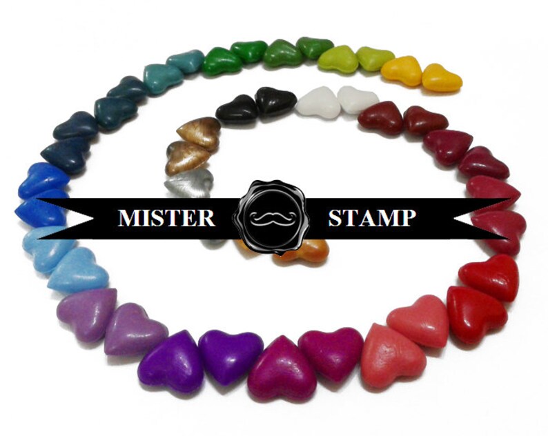 May include: A rainbow of heart-shaped wax seals arranged in a spiral pattern. The wax seals are in various colors, including red, orange, yellow, green, blue, purple, and brown. The text "MISTER STAMP" is printed on a black ribbon.