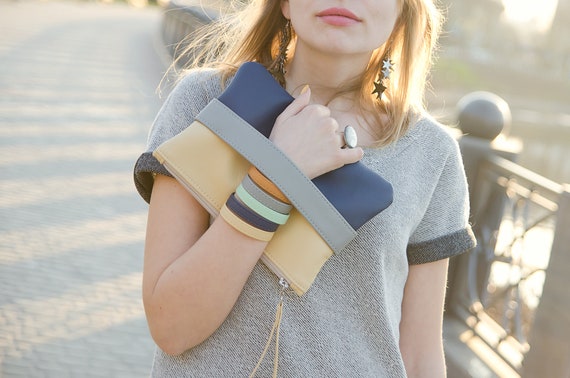 Navy clutch bag with wrist best sale strap