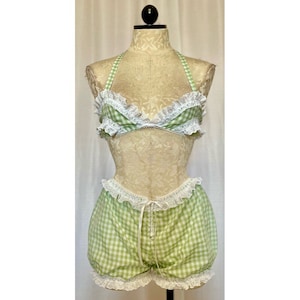 May include: Green and white gingham lingerie set with white lace trim. The set includes a halter top and shorts.