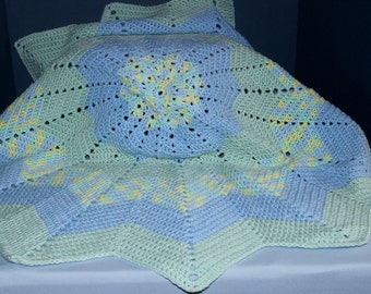 Crochet Round Ripple Baby Blanket with baby blue and mint green with variegated colors of green, blue, and yellow