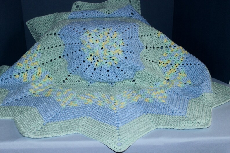 Crochet Round Ripple Baby Blanket with baby blue and mint green with variegated colors of green, blue, and yellow image 1