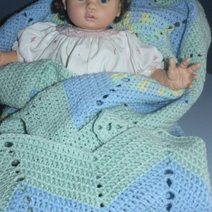 Crochet Round Ripple Baby Blanket with baby blue and mint green with variegated colors of green, blue, and yellow image 4