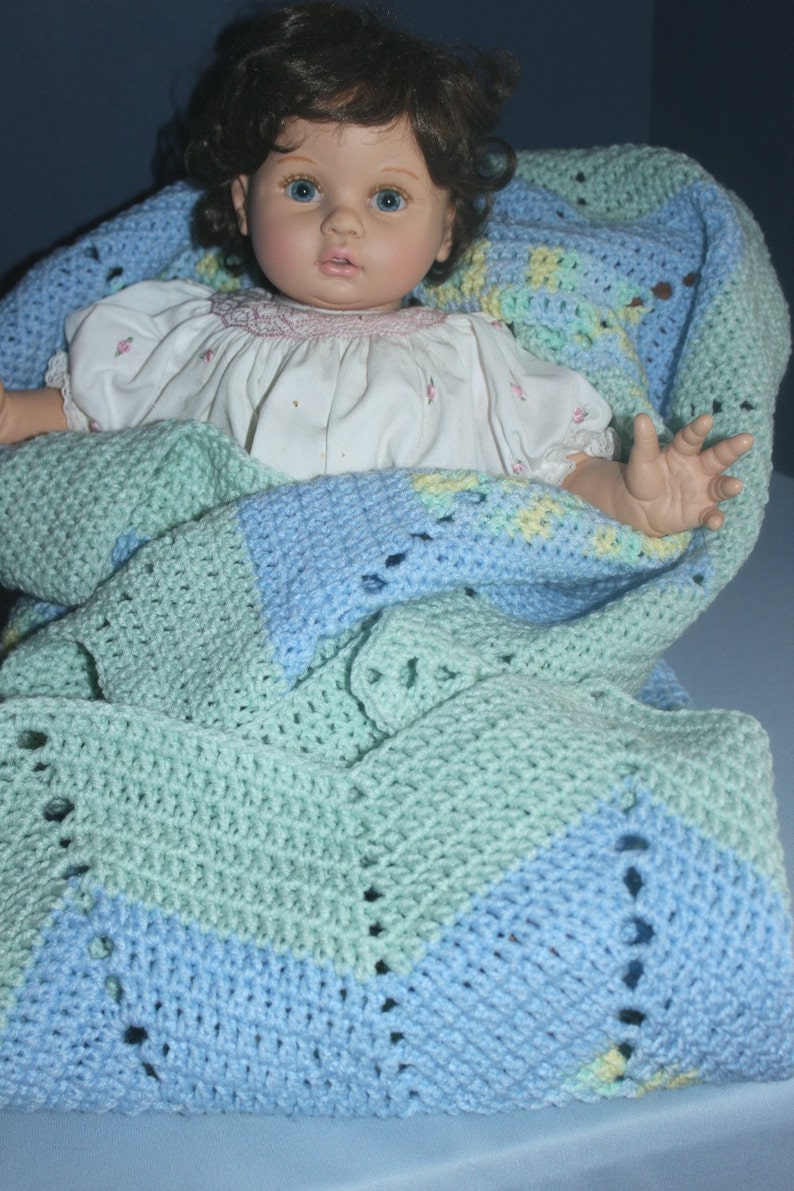 Crochet Round Ripple Baby Blanket with baby blue and mint green with variegated colors of green, blue, and yellow image 4