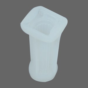 May include: White plastic mold for making a square column with a fluted design. The mold is made of silicone and has a smooth finish.