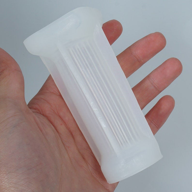 May include: White silicone grip with a ribbed texture. The grip is designed to be comfortable and secure.