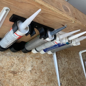 Caulk, silicone tube storage organizer. Perfect for vans, trailers. Solves storage problem by using space under shelve. New Product Added!