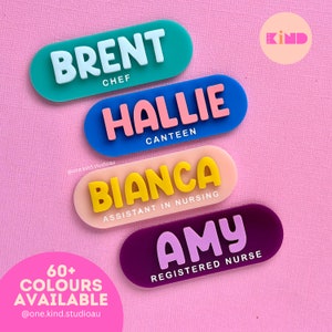 May include: Four colourful name badges with rounded edges are shown against a pink background. The badges display names like "BRENT" and "HALLIE," along with job titles such as "CHEF" and "CANTEEN." The text "60+ COLOURS AVAILABLE" is also visible.