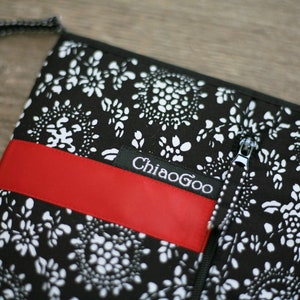 May include: Black and white patterned zippered pouch with a red fabric strip and the text "ChiaoGoo" on a black label.