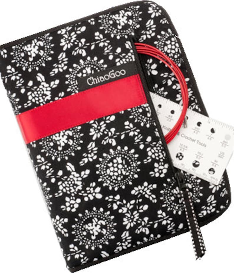May include: Black and white floral zippered case with a red stripe and the text "ChiaoGoo" on the front. The case has a zippered pocket on the side with red knitting needles and a crochet tool gauge.