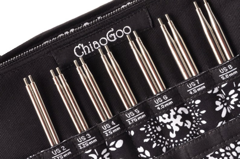 May include: A set of ChiaoGoo interchangeable knitting needles in a black zippered case. The needles are arranged in order of size, from US 2 (2.75 mm) to US 8 (5.0 mm).