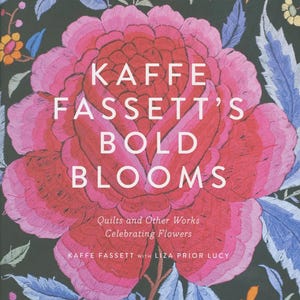 May include: A book cover featuring a large, embroidered pink and red flower with the text "KAFFE FASSETT'S BOLD BLOOMS." The cover also includes the text "Quilts and Other Works Celebrating Flowers" and the author's names. The background is dark with floral embroidery.