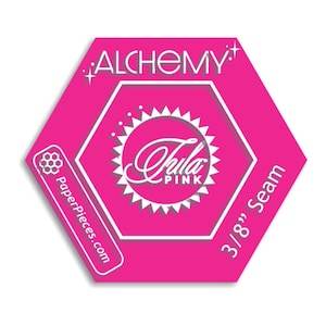 May include: A bright pink, hexagonal label with white text and accents. The label features the words "ALCHEMY" at the top, a circular design with "Tula Pink" in the center, and "3/8" Seam" on the right side. The website "PaperPieces.com" is also displayed.