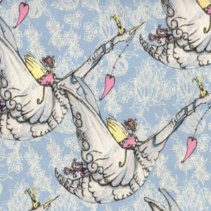 May include: A light blue fabric featuring a repeating pattern of white swans wearing yellow crowns and pink accents. Each swan holds a thin string with a dangling pink heart. The background is decorated with a delicate white floral line art design.