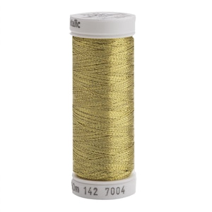 May include: A spool of metallic gold thread with a white plastic top and bottom. The top cap features the word metallic, and the bottom base displays the text 50m 142 7004. The thread is wound in a cross-hatch pattern around the central cylinder.