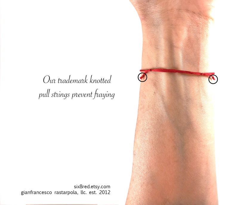 May include: A thin red string bracelet featuring knotted pull strings at both ends to prevent fraying. The text on the image reads: Our trademark knotted pull strings prevent fraying, six8red.etsy.com, gianfrancesco rastarpola, llc. est. 2012.