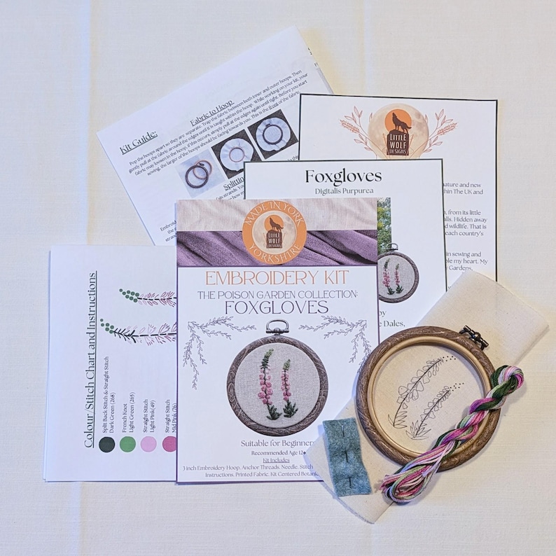 May include: Embroidery kit for beginners featuring a design of purple foxgloves. The kit includes a hoop, fabric, floss, and instructions. The kit is labelled "The Poison Garden Collection: Foxgloves".