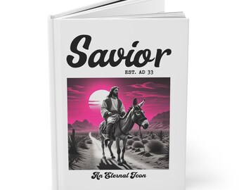May include: A book cover with a white background and a black and white illustration of Jesus riding a donkey on a pink and purple desert landscape. The title of the book is "Savior" with the text "EST. AD 33" below it. The text "An Eternal Icon" is at the bottom of the cover.