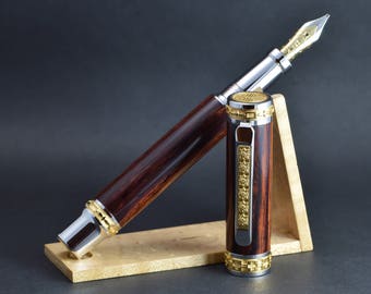 Satin Gold Emperor fountain pen in cocobolo wood equiped with an 18k solid gold nib