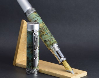 Stabilized spalted maple fountain pen dyed in green.
