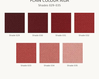May include: A collection of seven square Aida fabric swatches from Zoe's Stitchery Co. labeled Plain Colour Aida Shades 029-035. The swatches display a gradient of red tones, ranging from deep dark burgundy to a light pale pinkish hue.