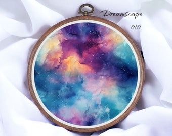 May include: A round wooden embroidery hoop with a colorful watercolor painting of a nebula. The painting features shades of blue, purple, pink, and yellow, with white dots representing stars. The hoop is labeled "Dreamscape 010".