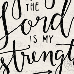 May include: Black and white typography design with the text "THE LORD IS MY STRENGTH".