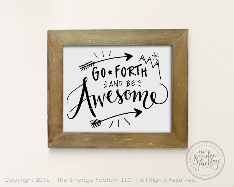 May include: A framed print with a white background and black text that reads "GO FORTH AND BE AWESOME". The text is in a handwritten style with arrows and a mountain range graphic. The frame is a light brown wood.