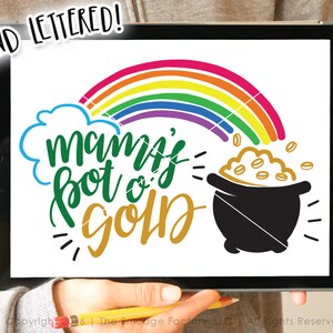 May include: A digital design featuring a rainbow, a cloud, a pot of gold, and the text "mama's pot o' gold" in a hand-lettered style.