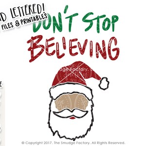 May include: Hand-lettered design featuring a Santa Claus with a red hat and white beard. The text reads "Don't Stop Believing".