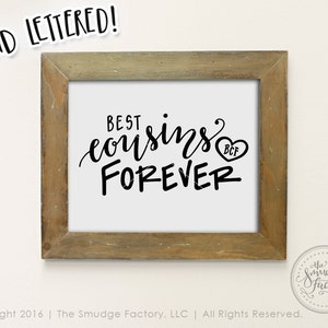 May include: A framed print with the text "Best cousins forever" in black script font. A small heart with the letters "BCF" is next to the word "forever".