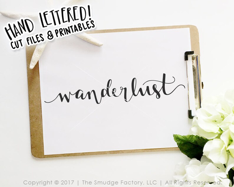 May include: A white sheet of paper with the word "wanderlust" written in black cursive script on a brown clipboard. The clipboard is on a white surface with a white starfish and white flowers.