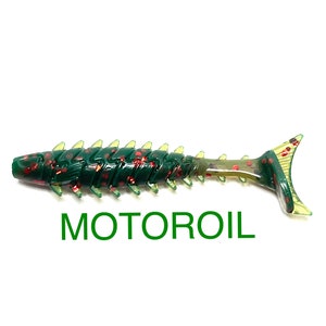 May include: Green and red segmented soft plastic fishing lure with a yellow tail fin. The lure is labeled "MOTOROIL".