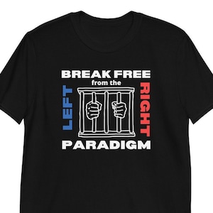 May include: Black t-shirt with a white graphic. The graphic features a jail cell with hands reaching out, and the text "BREAK FREE from the PARADIGM" above the cell. The words "LEFT" and "RIGHT" are on either side of the cell.