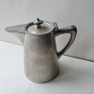 Vintage Danish Modern Creamer & Lid in Brown Mist by Dansk designs Denmark, light brown rim on a very light blue background