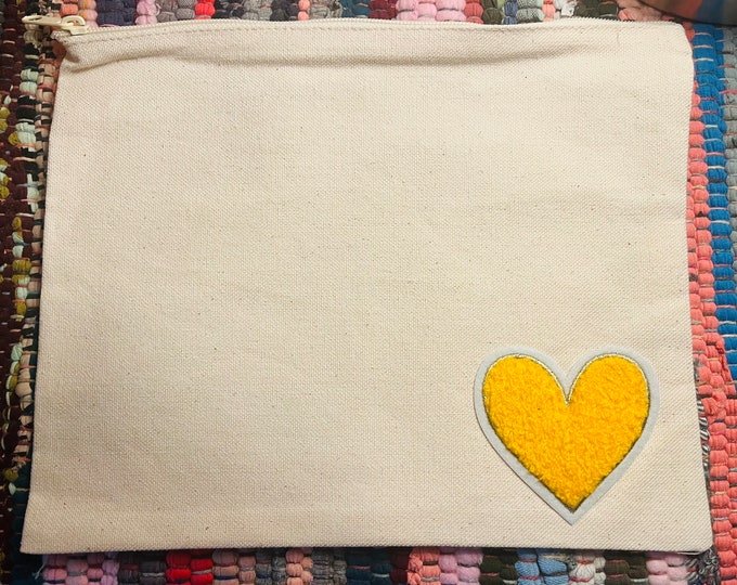 Canvas travel pouch with heart patch
