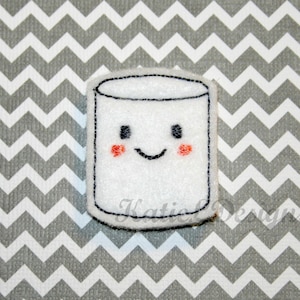 May include: White felt marshmallow applique with a smiling face and rosy cheeks. The marshmallow is outlined in black thread.