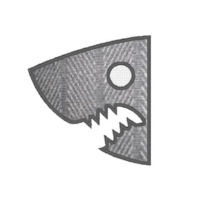 May include: A gray felt shark head patch with a white eye and teeth.