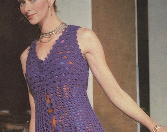 May include: A purple crochet vest with a V-neck and a button closure. The vest is sleeveless and has a loose fit.
