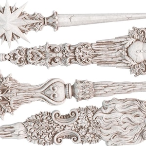 May include: Set of five white, ornate, decorative Christmas tree toppers. The toppers feature a snowflake, a star, a snowman, a Santa Claus, and a stylized floral design.