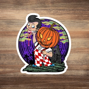 May include: A sticker featuring a Halloween-themed illustration. A boy with a pumpkin head and a checkered apron holds a knife and a plate with a severed head. The background includes a graveyard and the text "R.I.P. BOY".
